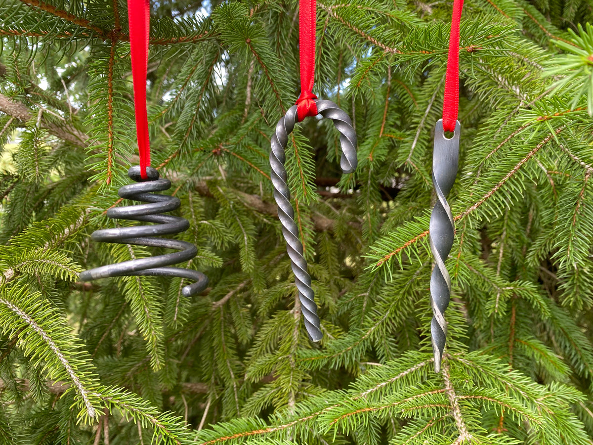 Three different forged Christmas ornaments made by Hutton Forge. 