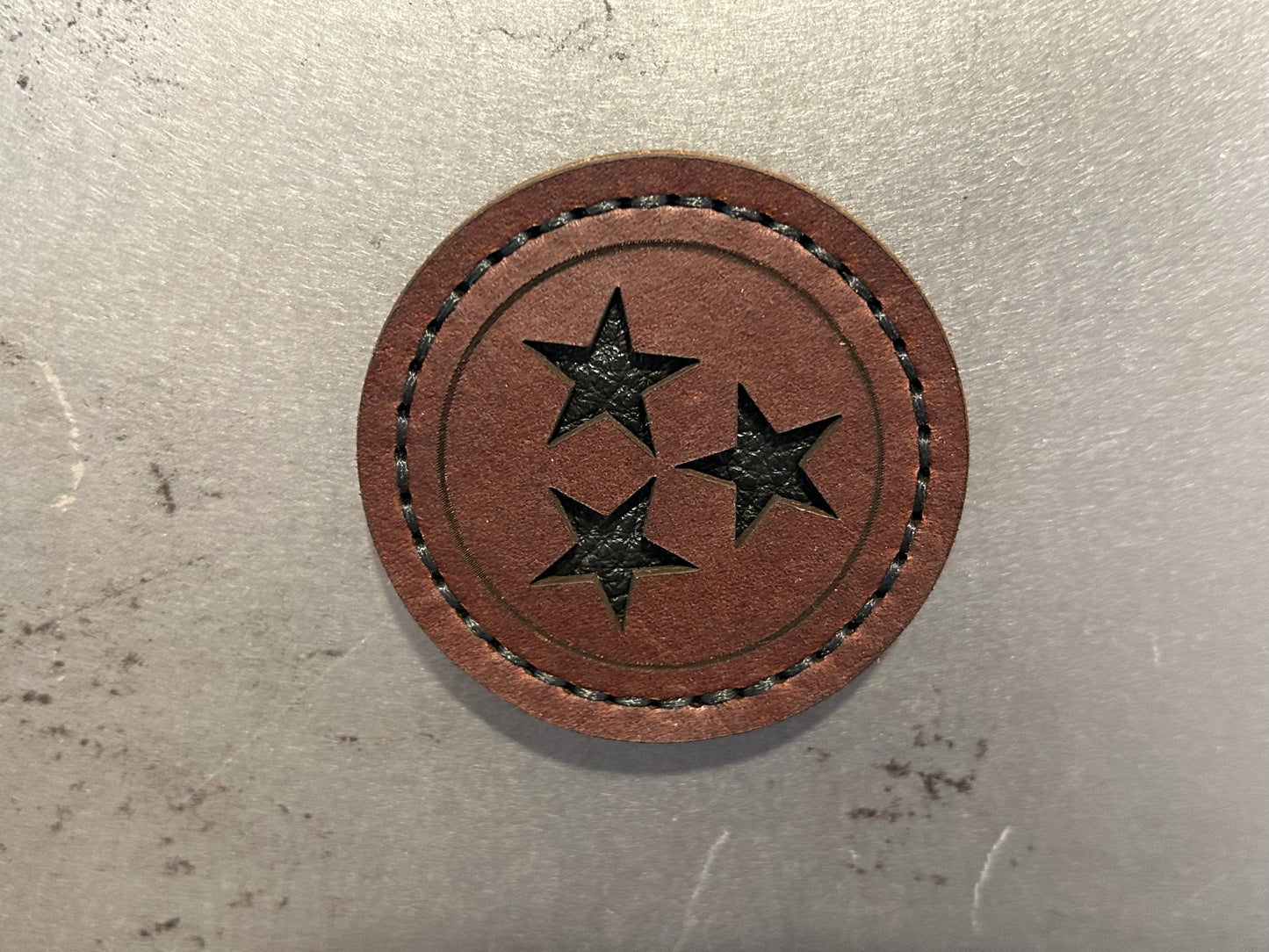 Brown leather Tennessee magnet with black stars and black stitching. Hutton Forge.