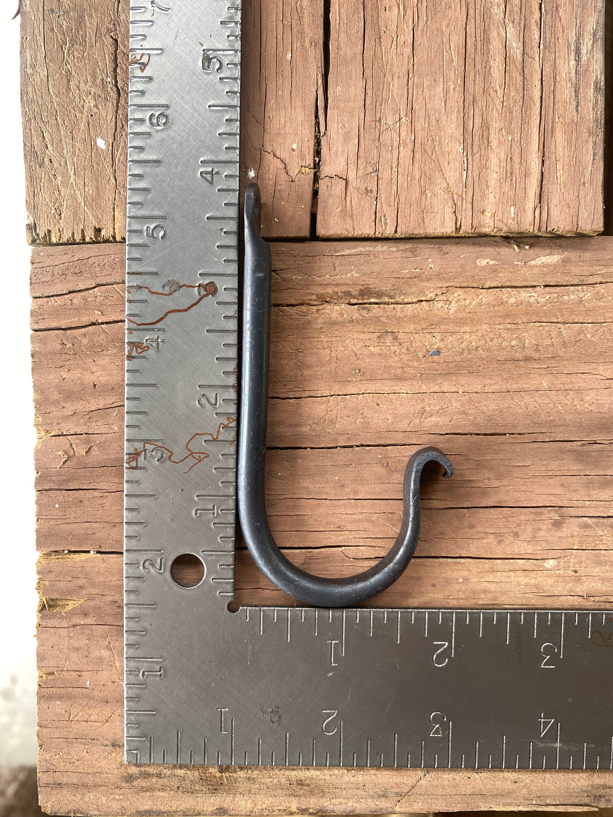 Ruler shows the size of one of the rustic wall hooks. 