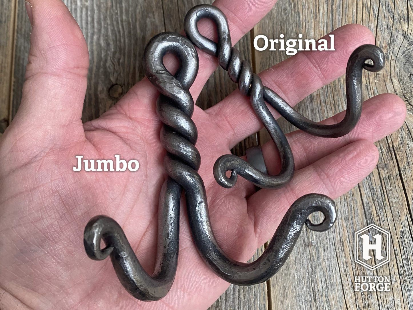Two hand-forged twisted double wall hooks in blackened steel, small and large. Hutton Forge.

