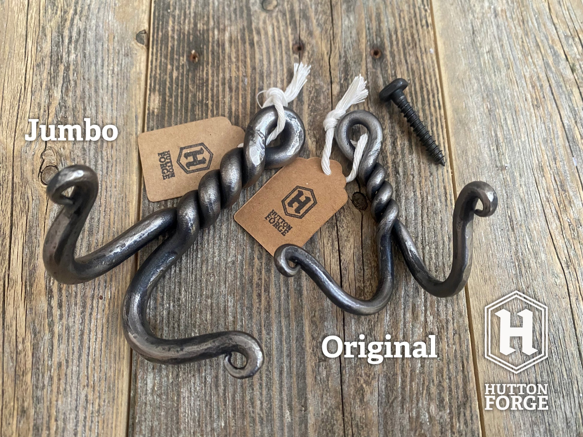 Two hand-forged twisted double wall hooks in blackened steel, small and large. Hutton Forge.