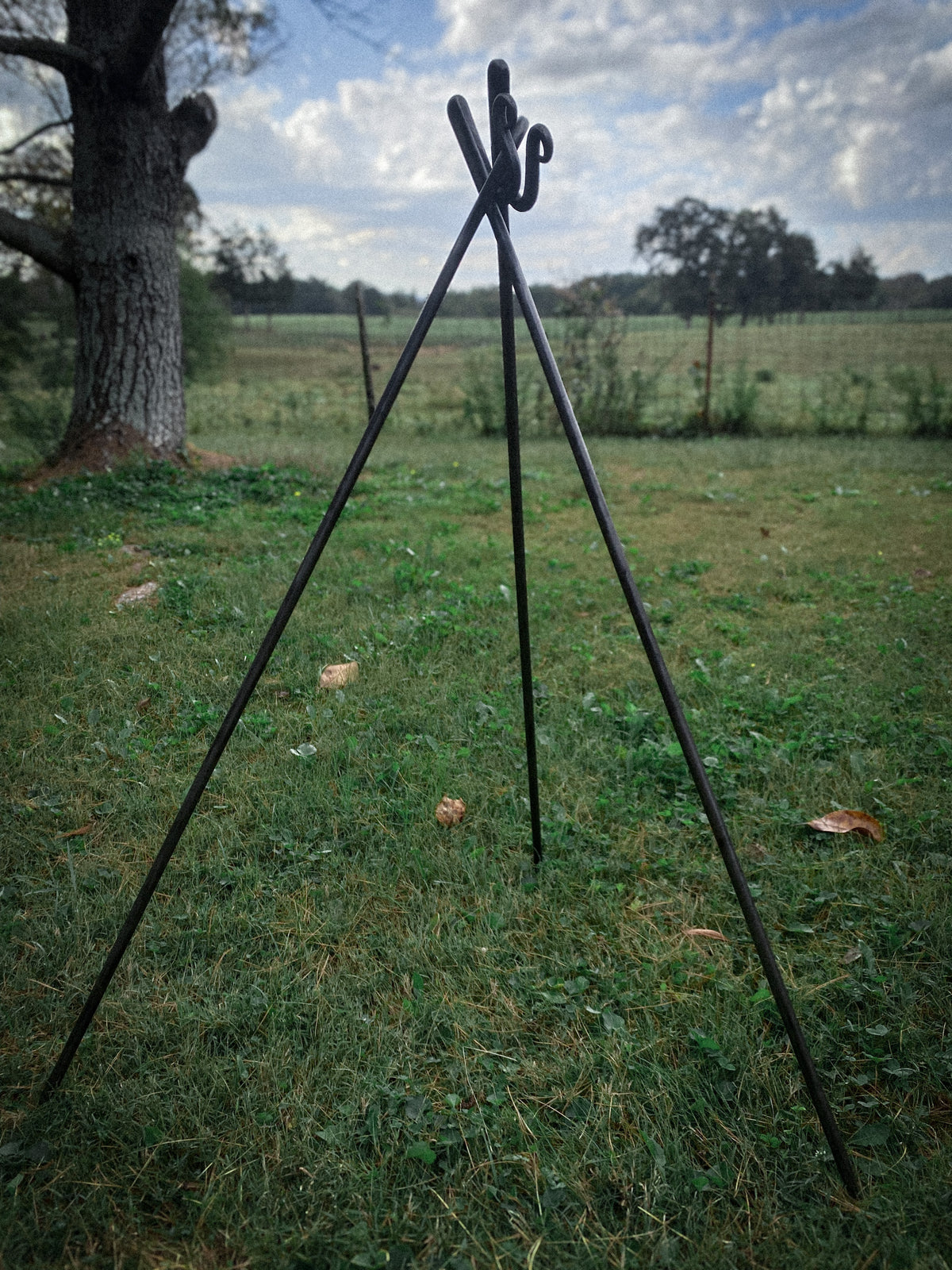 Hand-forged round steel campfire cooking tripod. Hutton Forge.