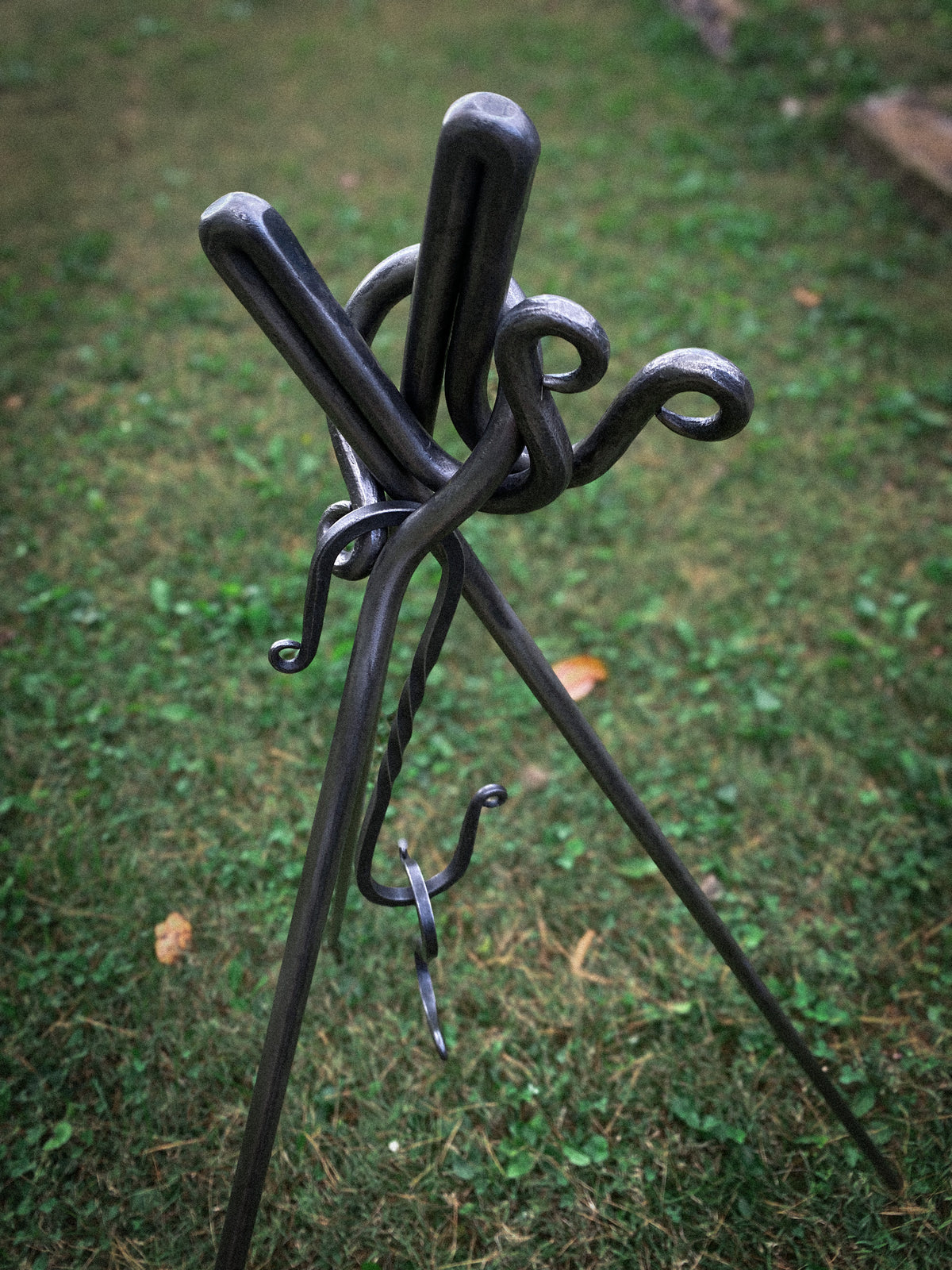 Hand-forged round steel campfire cooking tripod with 2 S hooks. Hutton Forge.