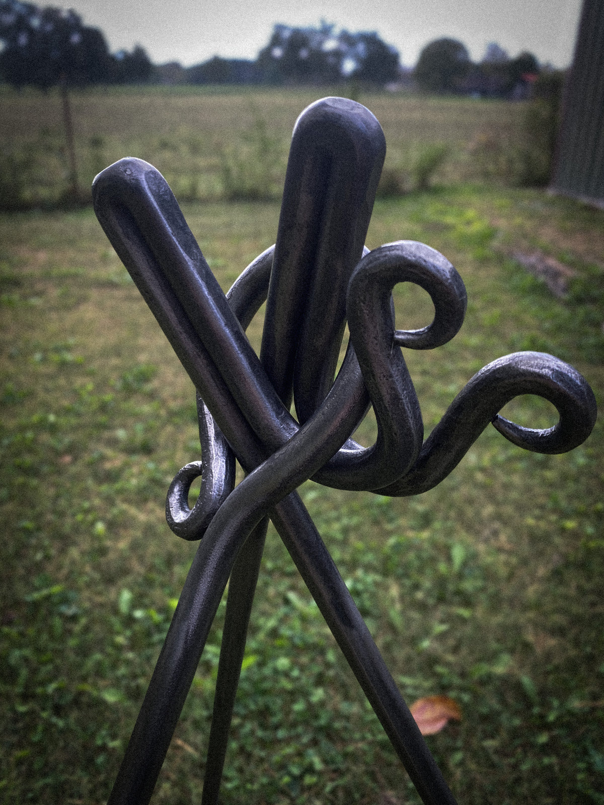 Hand-forged round steel campfire cooking tripod. Hutton Forge.
