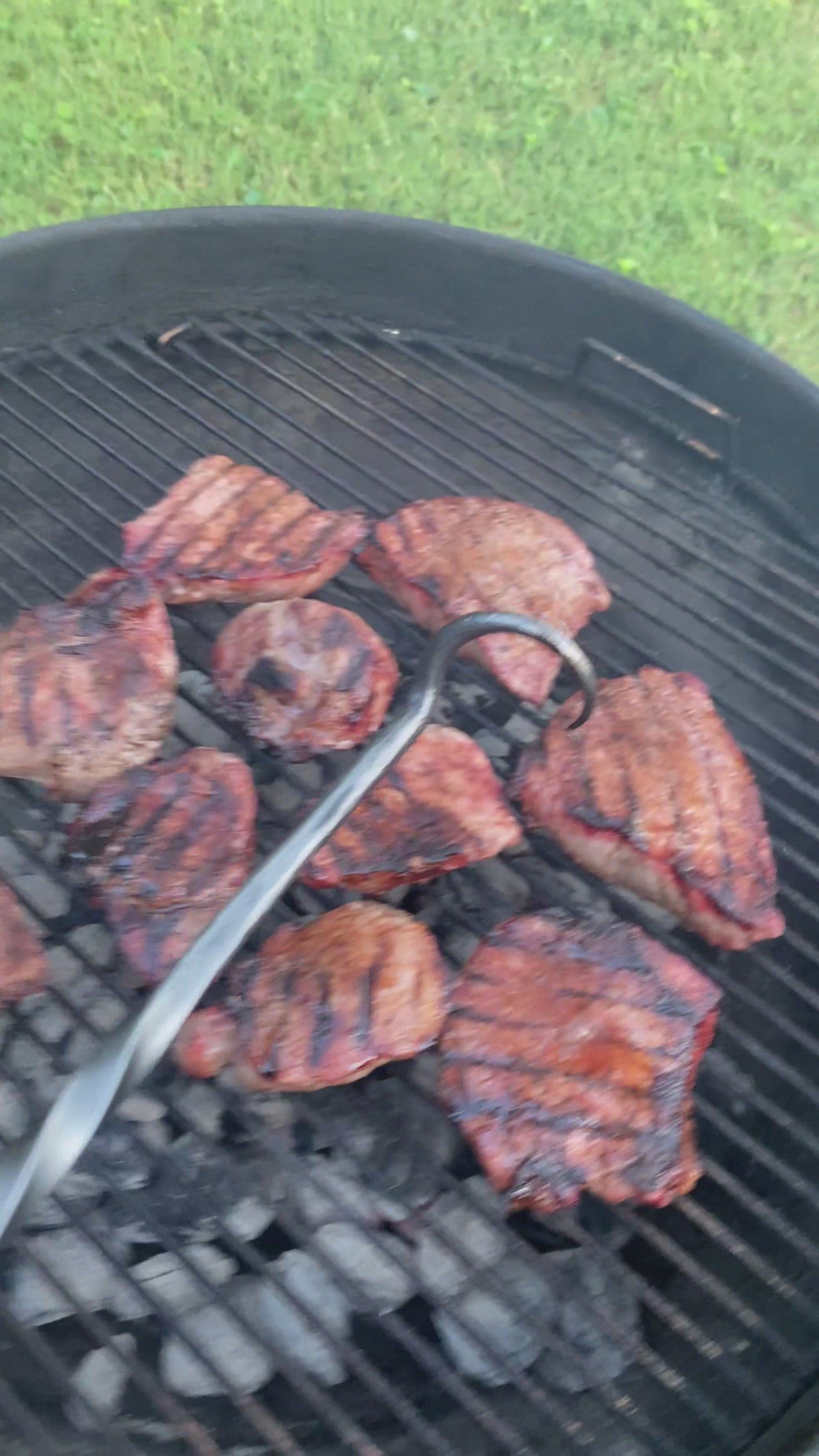 Video of Hand-forged steak flipper turning steaks over on the grill. Hutton Forge.
